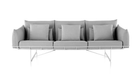 A light gray Wireframe three-seat sofa, viewed from the front. A light gray Wireframe three-seat sofa, viewed from the front.