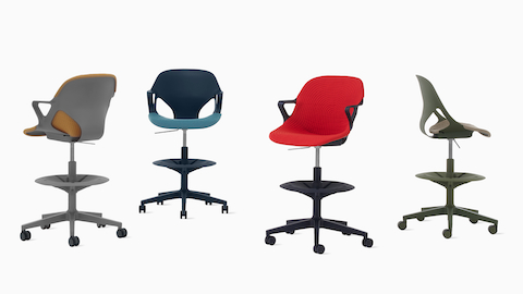 Four Zeph Stools in various angles including a cocoa stool with brown knit cover, a dark blue stool with a light blue knit seat pad, a black stool with a red seat cover and a olive stool with a light pink seat pad. Four Zeph Stools in various angles including a cocoa stool with brown knit cover, a dark blue stool with a light blue knit seat pad, a black stool with a red seat cover and a olive stool with a light pink seat pad.