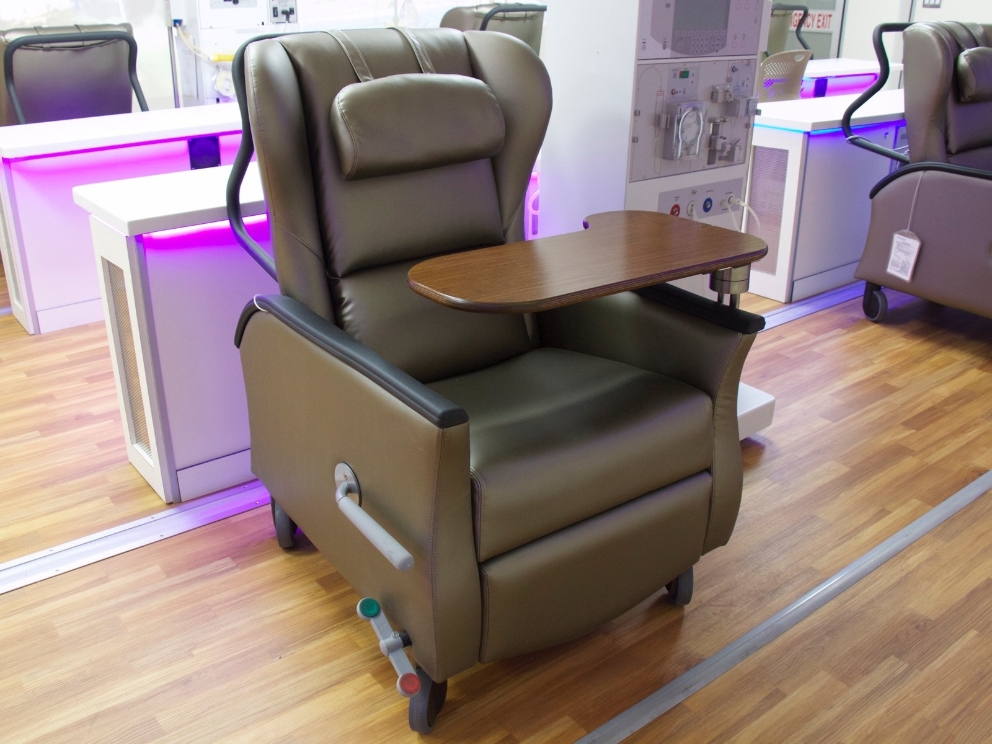 A brown Nemschoff Serenity Chair sits inside of a mobile dialysis unit. A brown Nemschoff Serenity Chair sits inside of a mobile dialysis unit.