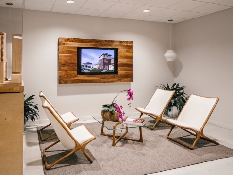 An inviting office lobby features Geiger Scissor chairs and a glass coffee table. An inviting office lobby features Geiger Scissor chairs and a glass coffee table.