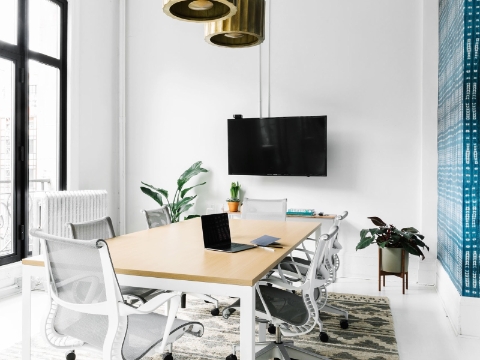 A bright conference room features natural light and Setu chairs. A bright conference room features natural light and Setu chairs.
