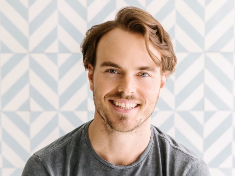 Nick Brown, CEO and founder of Soludos, smiles in his office. Nick Brown, CEO and founder of Soludos, smiles in his office.