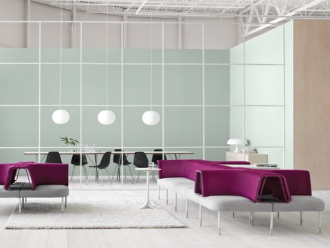 Gray and magenta Public Office Landscape seating adjacent to a glass-walled meeting room containing Eames Molded Plastic Chairs. Gray and magenta Public Office Landscape seating adjacent to a glass-walled meeting room containing Eames Molded Plastic Chairs.
