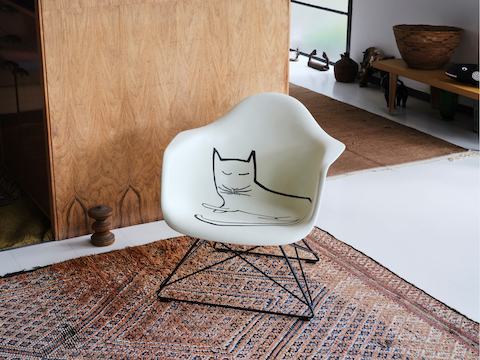 Eames Fiberglass Armchair with Steinberg Cat in the Eames House. Eames Fiberglass Armchair with Steinberg Cat in the Eames House.