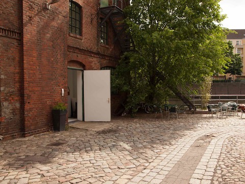 The Einstein room also has a back door onto the south-facing patio, which is adjacent to the coffee shop terrace, which the team can also use. Photo by Hello Design. The Einstein room also has a back door onto the south-facing patio, which is adjacent to the coffee shop terrace, which the team can also use. Photo by Hello Design.