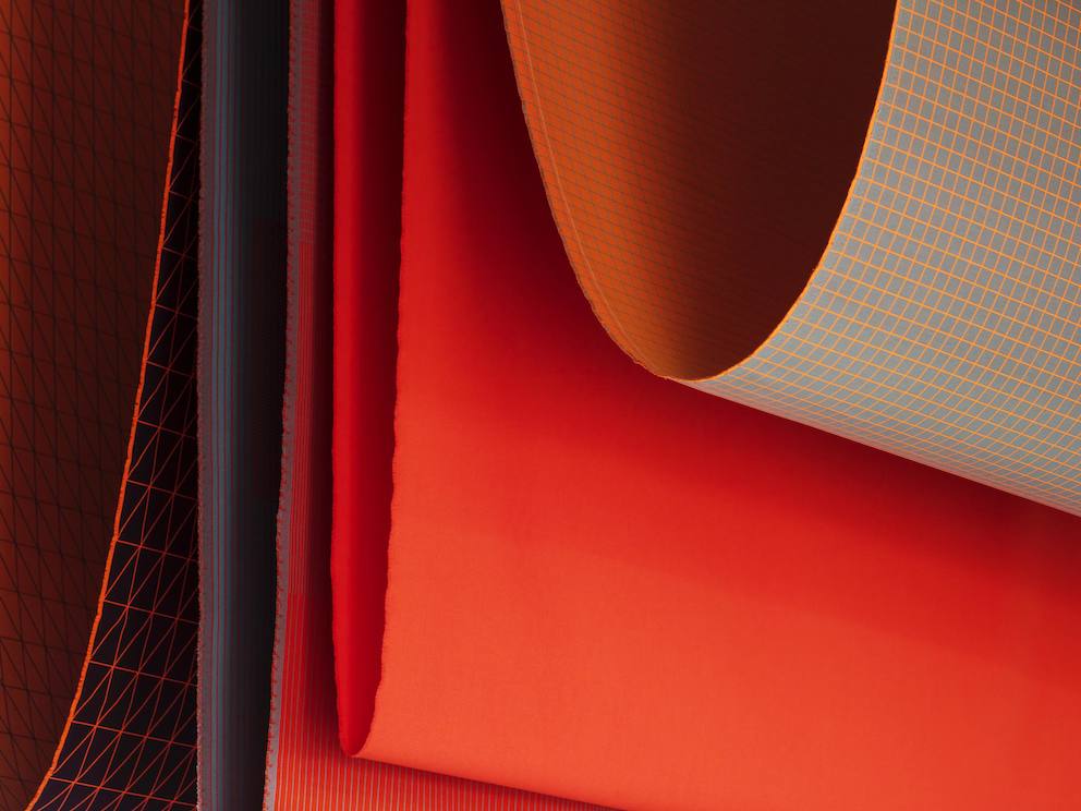 Clove view of textiles in various shades of red and orange. Clove view of textiles in various shades of red and orange.