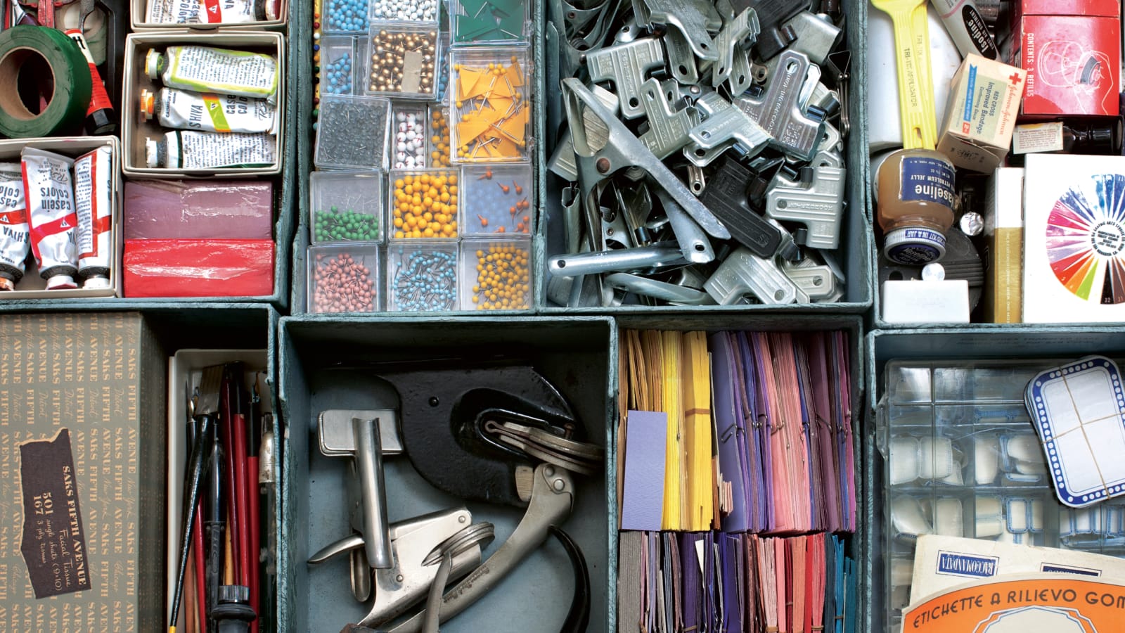Overhead shot of an open desk drawer, with various art and office supplies. Overhead shot of an open desk drawer, with various art and office supplies.
